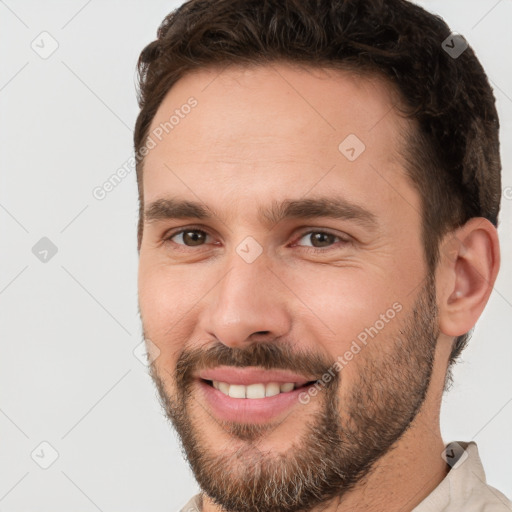 Joyful white young-adult male with short  brown hair and brown eyes