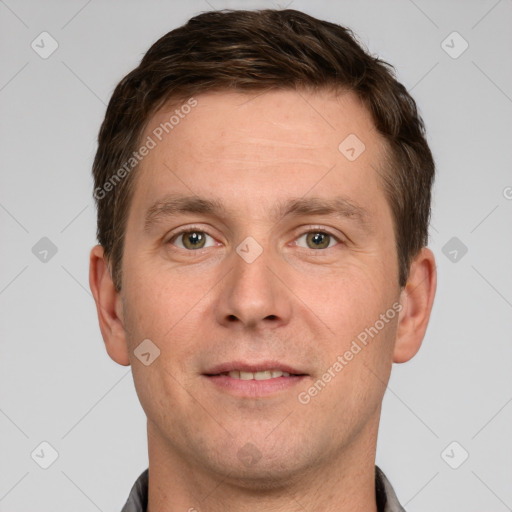 Joyful white adult male with short  brown hair and grey eyes