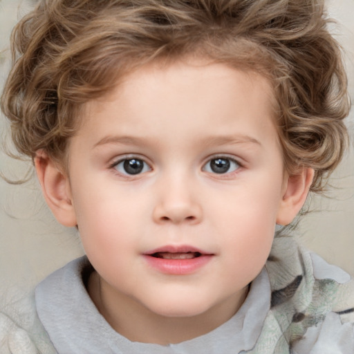 Joyful white child female with short  brown hair and blue eyes