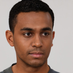 Neutral black young-adult male with short  brown hair and brown eyes