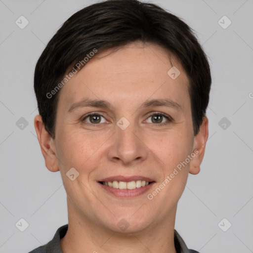 Joyful white young-adult female with short  brown hair and grey eyes