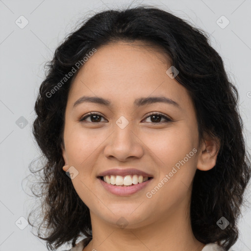 Joyful latino young-adult female with long  brown hair and brown eyes