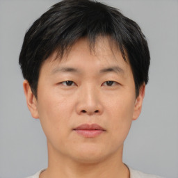 Neutral asian young-adult male with short  brown hair and brown eyes