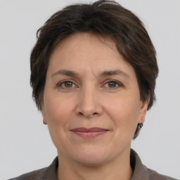 Joyful white adult female with short  brown hair and brown eyes