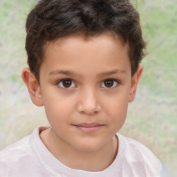 Joyful white child male with short  brown hair and brown eyes