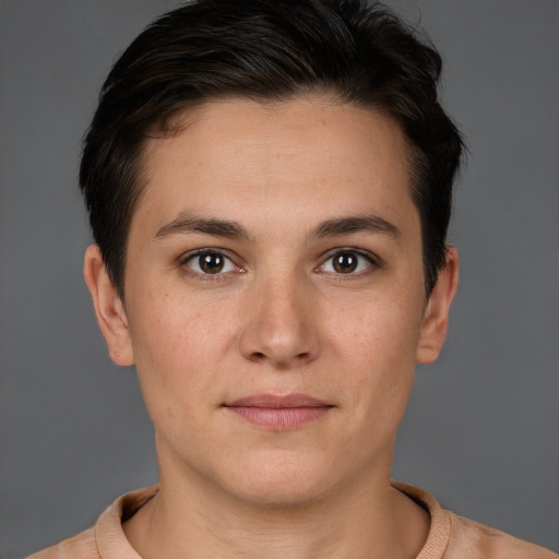 Joyful white young-adult female with short  brown hair and brown eyes