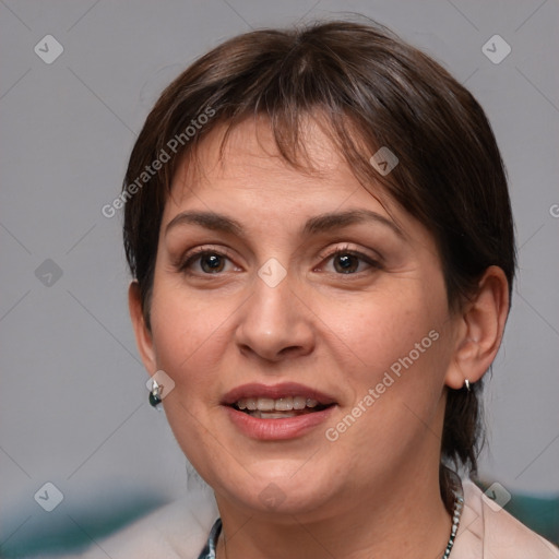 Joyful white adult female with medium  brown hair and brown eyes