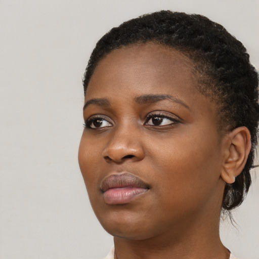 Neutral black young-adult female with short  black hair and brown eyes