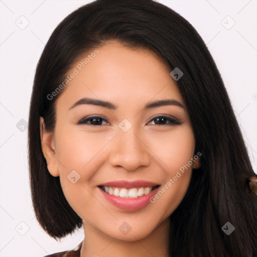 Joyful latino young-adult female with long  brown hair and brown eyes