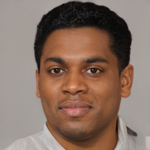 Neutral black young-adult male with short  black hair and brown eyes