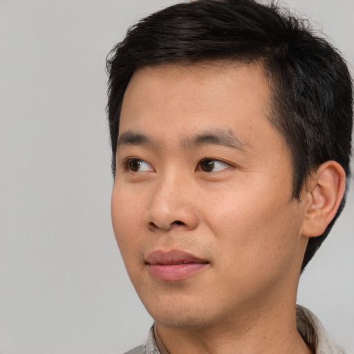 Neutral asian young-adult male with short  black hair and brown eyes