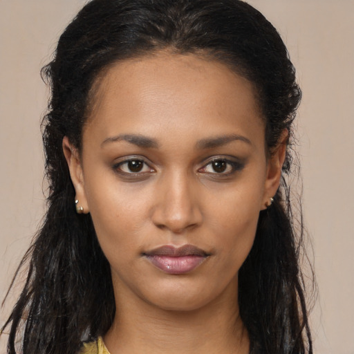 Neutral black young-adult female with long  brown hair and brown eyes