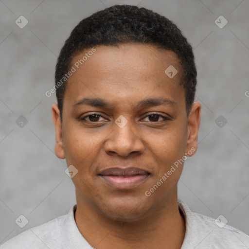 Joyful black young-adult male with short  black hair and brown eyes