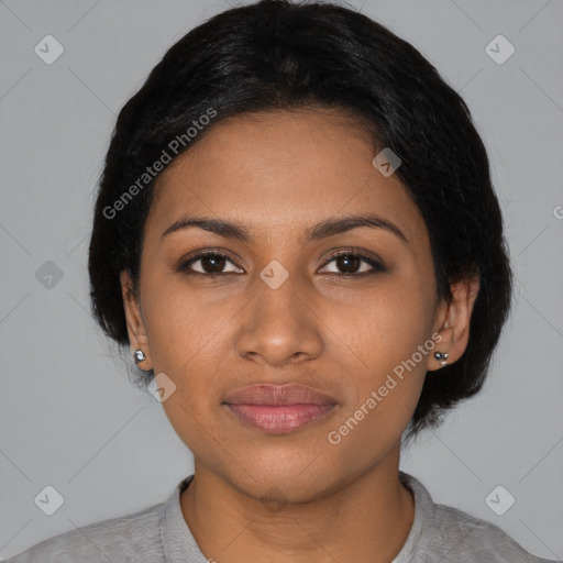 Joyful black young-adult female with short  black hair and brown eyes