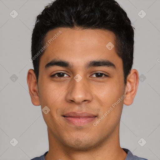 Joyful latino young-adult male with short  black hair and brown eyes