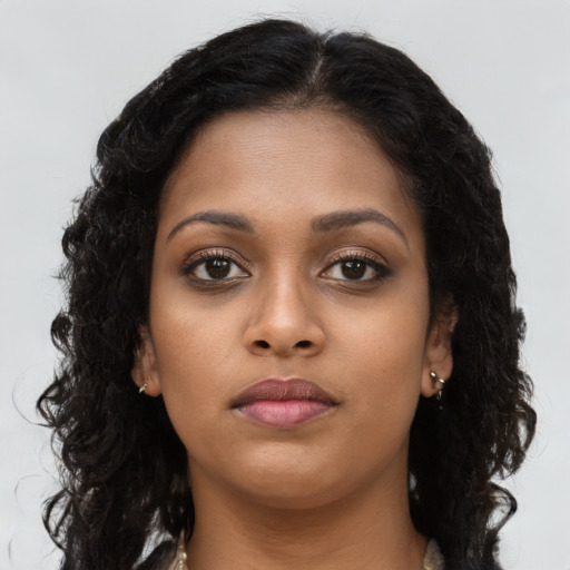 Neutral black young-adult female with long  brown hair and brown eyes