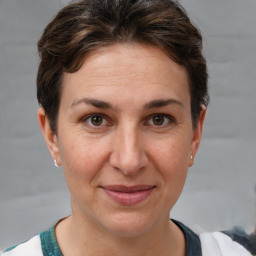 Joyful white adult female with short  brown hair and brown eyes