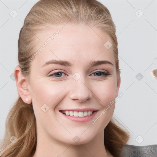 Joyful white young-adult female with long  brown hair and blue eyes