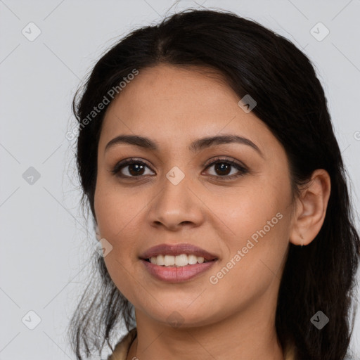 Joyful latino young-adult female with long  brown hair and brown eyes