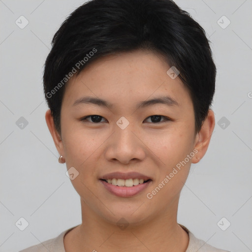 Joyful asian young-adult female with short  black hair and brown eyes