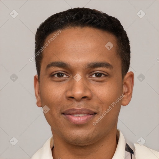 Joyful black young-adult male with short  black hair and brown eyes