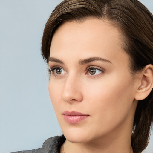 Neutral white young-adult female with medium  brown hair and brown eyes