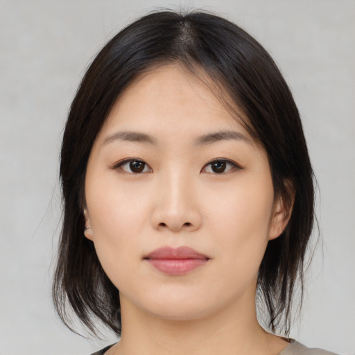 Neutral asian young-adult female with medium  brown hair and brown eyes
