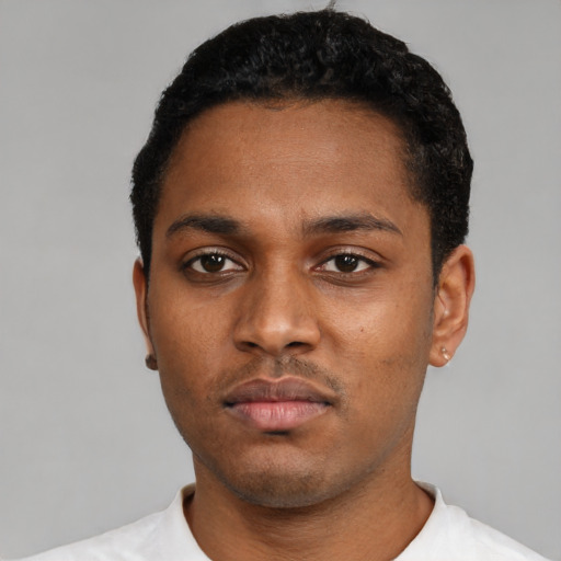 Neutral black young-adult male with short  black hair and brown eyes