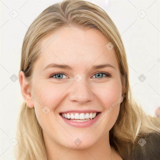 Joyful white young-adult female with long  brown hair and blue eyes