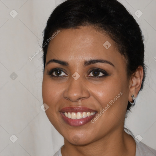 Joyful latino young-adult female with medium  brown hair and brown eyes