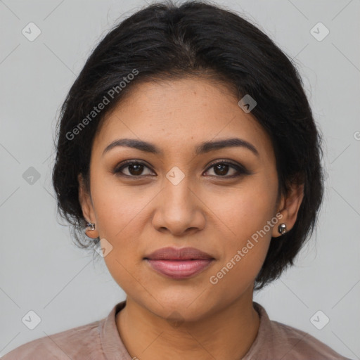 Joyful latino young-adult female with medium  brown hair and brown eyes