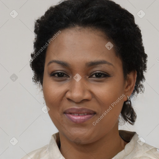 Joyful black adult female with short  brown hair and brown eyes