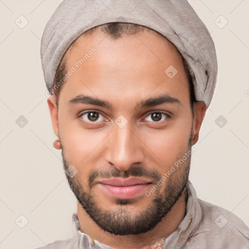 Joyful white young-adult male with short  black hair and brown eyes