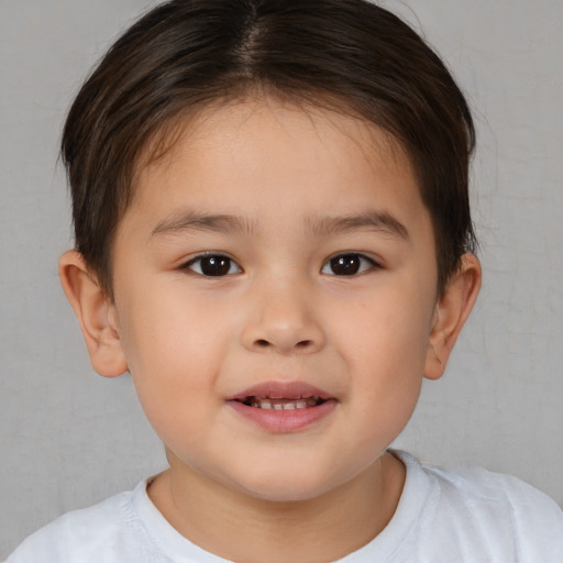 Joyful white child female with short  brown hair and brown eyes