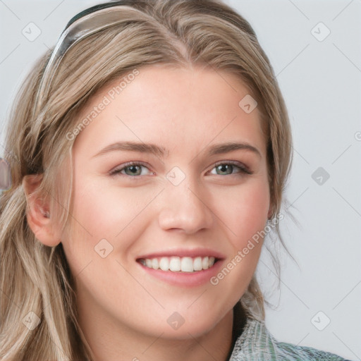 Joyful white young-adult female with long  brown hair and blue eyes