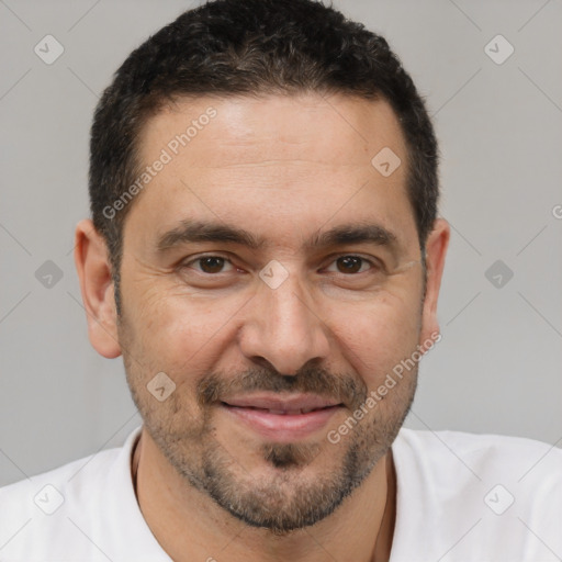 Joyful white adult male with short  brown hair and brown eyes