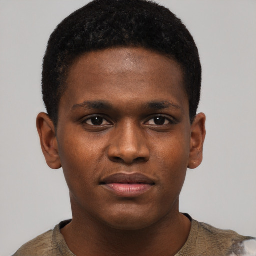 Joyful black young-adult male with short  brown hair and brown eyes