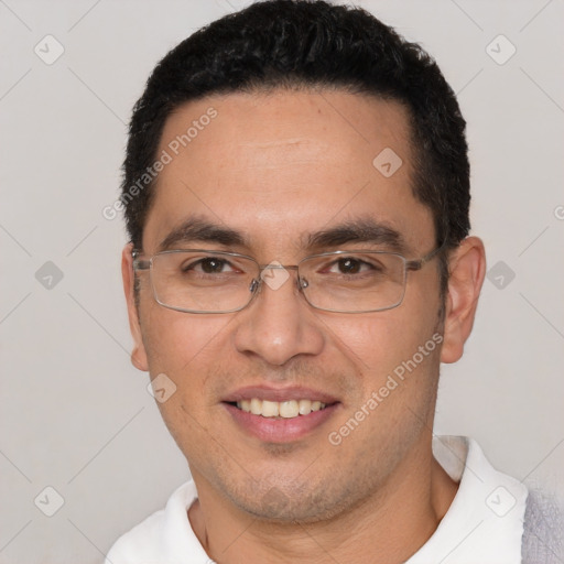 Joyful white young-adult male with short  black hair and brown eyes