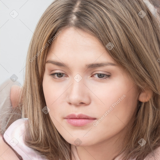 Neutral white young-adult female with long  brown hair and brown eyes