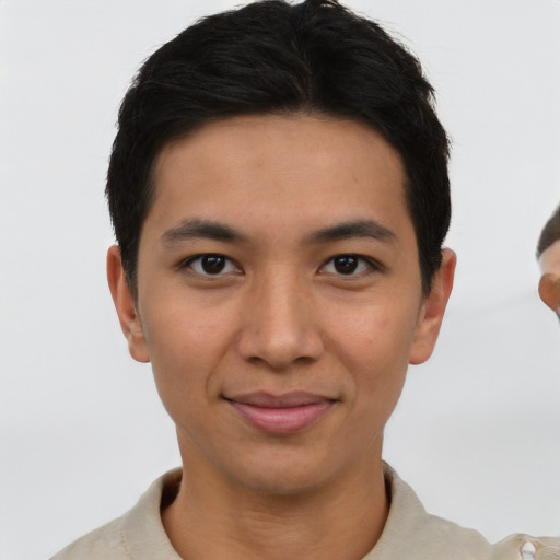 Joyful asian young-adult male with short  brown hair and brown eyes