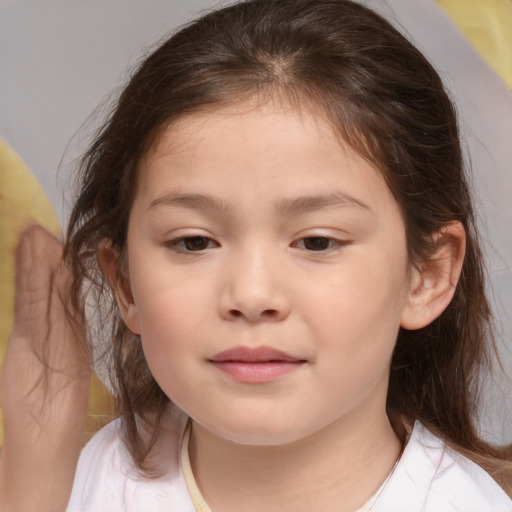 Joyful white child female with medium  brown hair and brown eyes