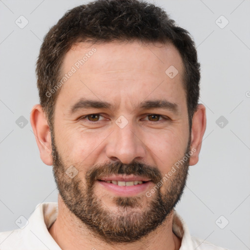 Joyful white adult male with short  brown hair and brown eyes