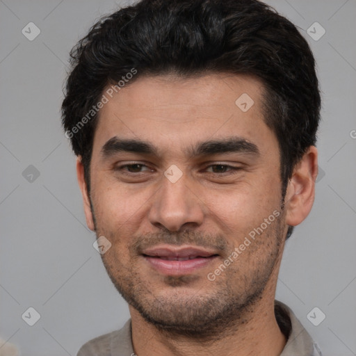 Joyful white young-adult male with short  black hair and brown eyes