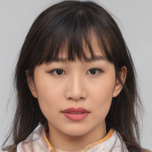 Neutral asian child female with medium  brown hair and brown eyes