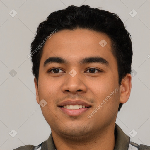 Joyful latino young-adult male with short  black hair and brown eyes