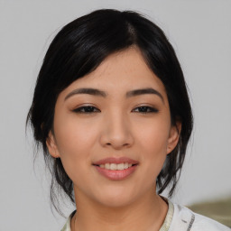 Joyful asian young-adult female with medium  black hair and brown eyes