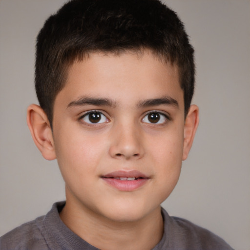 Joyful white child male with short  brown hair and brown eyes