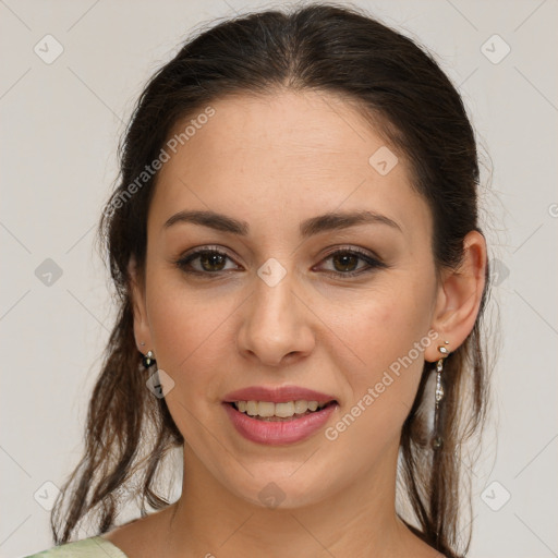 Joyful white young-adult female with medium  brown hair and green eyes