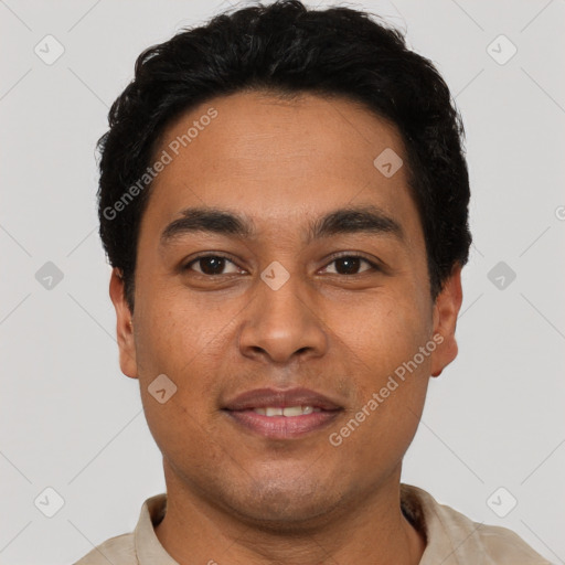 Joyful latino young-adult male with short  black hair and brown eyes