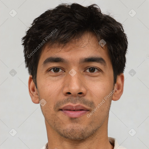 Joyful asian young-adult male with short  brown hair and brown eyes